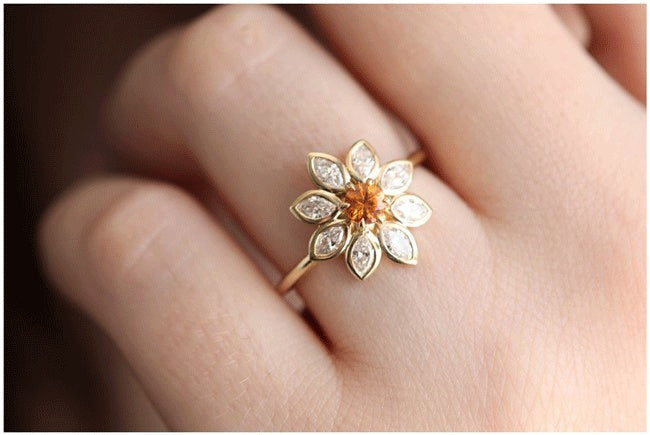 Velora Ring diamond studded sunflower ring with gold band worn on finger